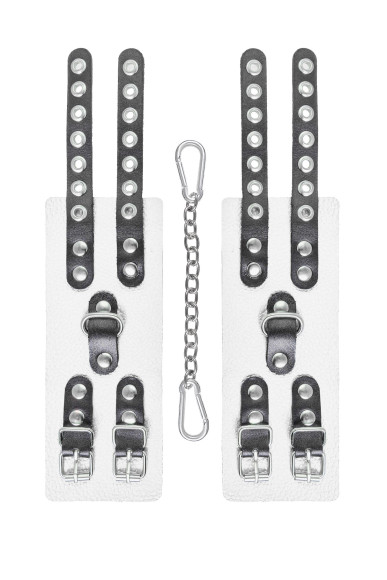 Бело-черные наручники с двумя ремешками и люверсами Бело-черные наручники с двумя ремешками и люверсами