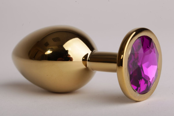 Золотистая анальная пробка с филетовым кристаллом - 8,2 см.